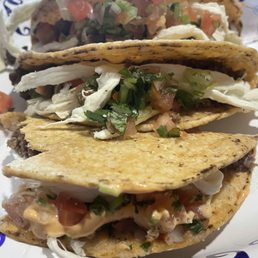 Hard shell tacos with ground beef, pico de gallo, oaxaca cheese, and chipotle mayo.