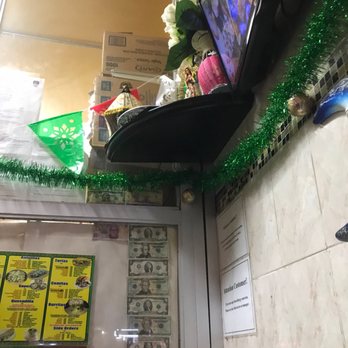 Lupitas Restaurante - a view of a counter with a tv on it - Mexican Near Me - Bronx, New York Lupitas Restaurante - a view of a counter with a tv on it - Mexican Near Me - Bronx, New York
