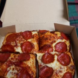 Cheese and pepperoni deep dish pizza at Little Caesars Pizza With a soda (20oz.)