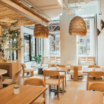 Prasino - Interior: tables, seating, large windows facing the city. - Mediterranean Near Me - Chicago, Illinois Prasino - Interior: tables, seating, large windows facing the city. - Mediterranean Near Me - Chicago, Illinois