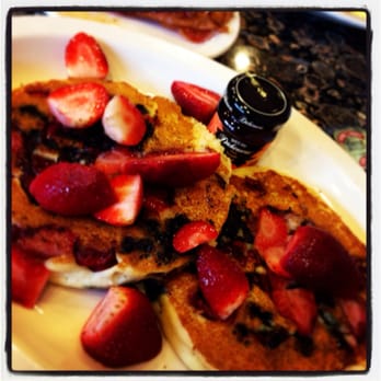 Ball Square Cafe - Gluten free, tri-berry pancakes with real maple syrup. Bacon is photobombing in the background. - Breakfast & Brunch Near Me - Somerville, Massachusetts Ball Square Cafe - Gluten free, tri-berry pancakes with real maple syrup. Bacon is photobombing in the background. - Breakfast & Brunch Near Me - Somerville, Massachusetts