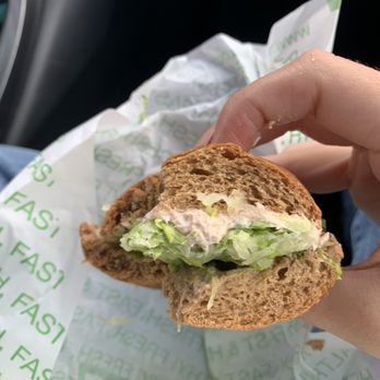 ThunderCloud Subs - a hand holding a sandwich - Sandwiches Near Me - Austin, Texas
