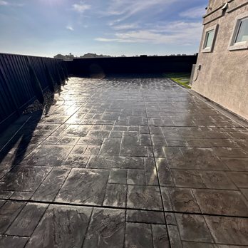 Complete Landscape - STAMPED CONCRETE WITH SEALANT, ALSO CURVED BORDER WITH CYPRESS TREES & DECORATIVE ROCKS. FENCE STAINED - Landscaping Near Me - Oakley, California