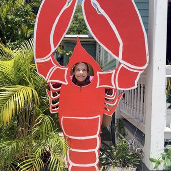 The Lobster Shack Key West - Mom in the lobster cutout out front - Seafood Near Me - Key West, Florida