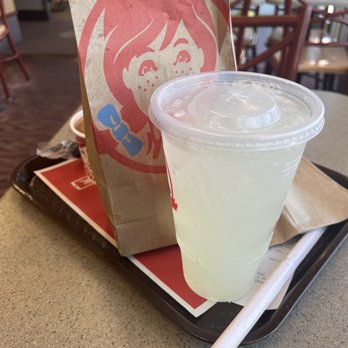 Wendy's - a drink and a paper bag on a table - Burgers Near Me - Southfield, Michigan