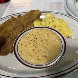Fried flounder, cheese grits, & scrambled eggs. Fried flounder, cheese grits, & scrambled eggs.