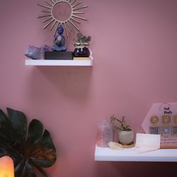 Sol Body - Cute wall set up of crystals on her shelves.