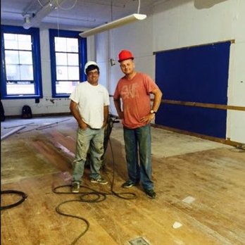 Celtic Floorcraft - two men standing in an empty room - Flooring Near Me - Boston, Massachusetts