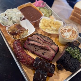 Interstellar BBQ - Potato Salad, beans, Mac n cheese, banana pudding, beef ribs, peach tea glazed pork belly, Jalapeño popper sausage and brisket - Barbeque Near Me - Austin, Texas
