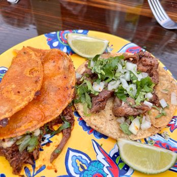 Tacotlan - Left side taco Birria de consumme. The right side, Lengua Taco. Both were delicious! - Mexican Near Me - Chicago, Illinois Tacotlan - Left side taco Birria de consumme. The right side, Lengua Taco. Both were delicious! - Mexican Near Me - Chicago, Illinois