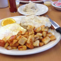 Chicken fried steak biscuit and gravy with a full stack of red velvet pancakes!