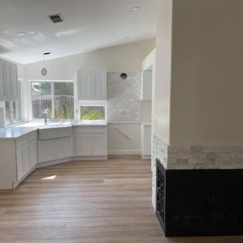 Lira Construction Group - a kitchen and living room - General Contractors Near Me