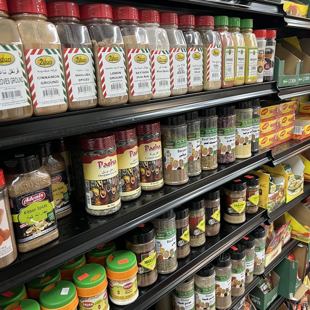 AL Madina - shelves of spices in a grocery store - Delis Near Me - Brandon, Florida