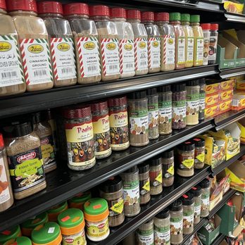 AL Madina - shelves of spices in a grocery store - Delis Near Me - Brandon, Florida