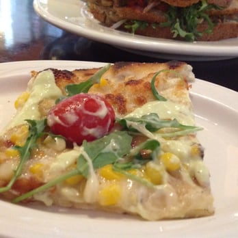 Rail Trail Flatbread - Maynoaise, arugula, corn, tomato, bacon pizza. - Bars Near Me - Hudson, Massachusetts