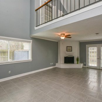 Floors N Design - a living room with tile floors - Carpet Installation Near Me - Houston, Texas