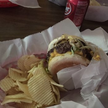 The Flamingo Lounge - My double cheese burger  and chips. Just can't go wrong. Oh, had the chili cheese nachos also, very good. - American Near Me - Enid, Oklahoma