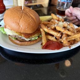 Burger with pineapple and fries. Burger with pineapple and fries.