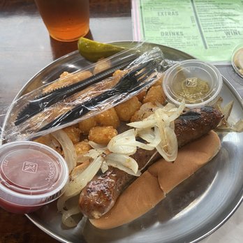 Alpine Brew Deck - Bratwurst with Sautéed Onions & tater tots - Sports Bars Near Me - Helen, Georgia