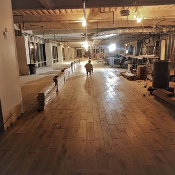 DJS Remodeling - a large room with wood floors - Flooring Near Me DJS Remodeling - a large room with wood floors - Flooring Near Me