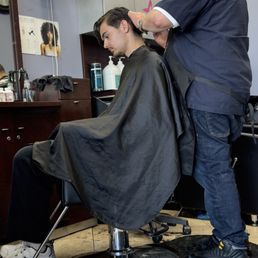 Getting a haircut at Peter's Salon.