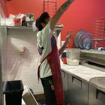 Graffiti pizza - Chef Matt Molina hand throwing dough - Pizza Near Me - Oakland, California