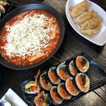 Roll - Roppoki combo topped with Cheese with a serving Dumplings. Accompanied by Kimchi Kimbap. - Korean Near Me - Toronto, Ontario