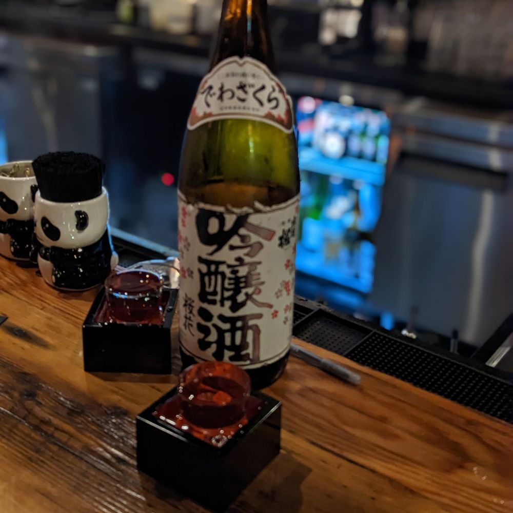 Shōjō Cambridge - a bottle of sake sitting on a bar - Asian Fusion Near Me - Cambridge, Massachusetts Shōjō Cambridge - a bottle of sake sitting on a bar - Asian Fusion Near Me - Cambridge, Massachusetts