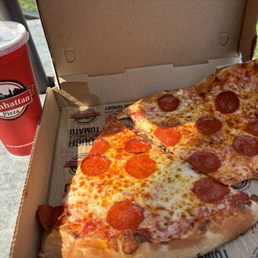 Two slices of pepperoni and a soda