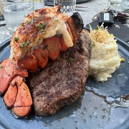 Lobster tail, medium rare steak with mashed potatoes