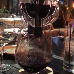 Aerating the red wine at the table! Aerating the red wine at the table!