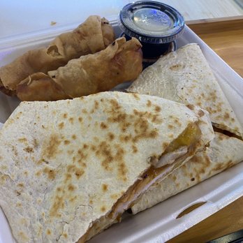 Wrap & Roll - International bento box. Giant chicken quesadilla with 2 eggs rolls (not pictured is the fusion fries and salad) - Asian Fusion Near Me - Houston, Texas Wrap & Roll - International bento box. Giant chicken quesadilla with 2 eggs rolls (not pictured is the fusion fries and salad) - Asian Fusion Near Me - Houston, Texas