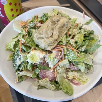 Just Salad - Paramus - a plate of salad and a can of soda - Salad Near Me - Paramus, New Jersey