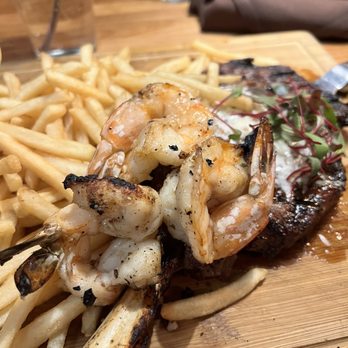 The Mill Steakhouse + Spirits - 22 ox ribeye with Mexican white prawns - Sports Bars Near Me - Milton, Washington The Mill Steakhouse + Spirits - 22 ox ribeye with Mexican white prawns - Sports Bars Near Me - Milton, Washington