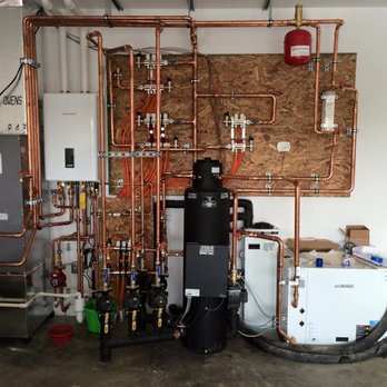 Dean Heating & Cooling - Water to water geothermal system that heats the house with radiant floor tubing and cools the house with a water coil in the air handler. - Heating & Air Conditioning/HVAC Near Me - Athens, Ohio Dean Heating & Cooling - Water to water geothermal system that heats the house with radiant floor tubing and cools the house with a water coil in the air handler. - Heating & Air Conditioning/HVAC Near Me - Athens, Ohio