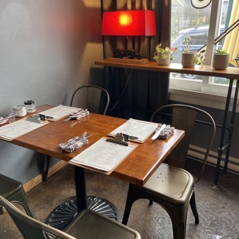 Whiskey Six BBQ - a table and chairs in a restaurant - Barbeque Near Me - Vancouver, British Columbia