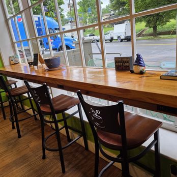 Little Green Hive - A beautiful window seating areas provides a lovely view of the outside on a bright Spring day. - Coffee & Tea Near Me - Roanoke, Virginia