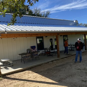 4C Market - two people standing outside of a building - Farmers Market Near Me - Gause, Texas 4C Market - two people standing outside of a building - Farmers Market Near Me - Gause, Texas