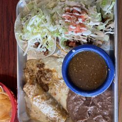 Carter's Cantina - This is a Cantina Combo. It has an Enchilada, a soft taco and a tostada with a side of refried beans and green salsa.