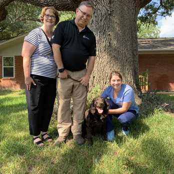 Four Paws at Fulshear Veterinary Clinic - Dr. Denney with our clients, the Strittmatters, and their Champion Boykin Spaniel, Boo. - Veterinarians Near Me - Fulshear, Texas Four Paws at Fulshear Veterinary Clinic - Dr. Denney with our clients, the Strittmatters, and their Champion Boykin Spaniel, Boo. - Veterinarians Near Me - Fulshear, Texas