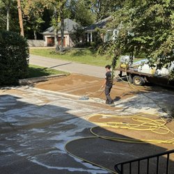 Brown's Pressure Washing - Washing garage pad