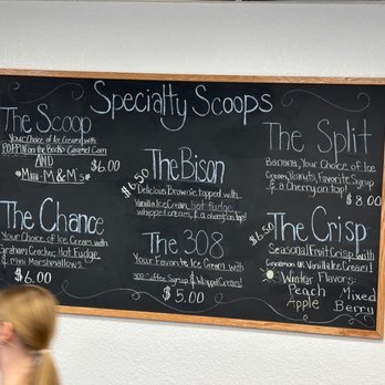 The Scoop Ice Cream - a woman walking past a chalkboard - Ice Cream & Frozen Yogurt Near Me - McCook, Nebraska The Scoop Ice Cream - a woman walking past a chalkboard - Ice Cream & Frozen Yogurt Near Me - McCook, Nebraska