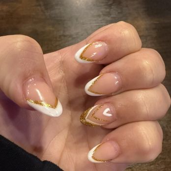 Passion Nails Spa - Almond shape with v-shaped French tip and gold glitter design. - Nail Salons Near Me - Melbourne, Florida Passion Nails Spa - Almond shape with v-shaped French tip and gold glitter design. - Nail Salons Near Me - Melbourne, Florida