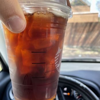 Starbucks - a hand holding a cup of iced coffee - Coffee & Tea Near Me - Newport News, Virginia