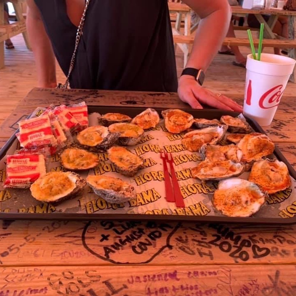 Flora-Bama Lounge, Package & Oyster Bar - The trio taster for oysters then the Cajun and garlic Parmesan oysters! - Music Venues Near Me - Pensacola, Florida Flora-Bama Lounge, Package & Oyster Bar - The trio taster for oysters then the Cajun and garlic Parmesan oysters! - Music Venues Near Me - Pensacola, Florida