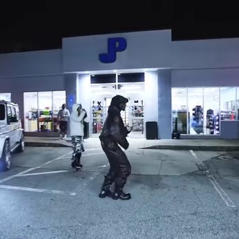 Valero - a man standing in a parking lot at night - Gas Stations Near Me - Atlanta, Georgia Valero - a man standing in a parking lot at night - Gas Stations Near Me - Atlanta, Georgia