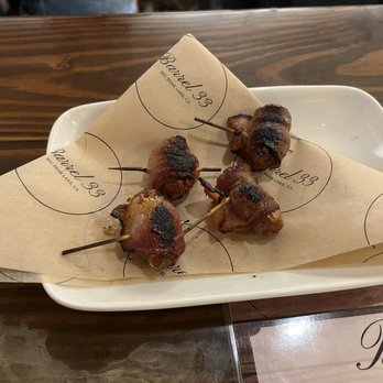 Barrel 33 - Bacon wrapped dates. You get 4 teeny tiny ones for $18. Definitely not worth it, bacon was burnt and not fully cooked. executed badly - Wine Tasting Room Near Me - Big Bear Lake, California Barrel 33 - Bacon wrapped dates. You get 4 teeny tiny ones for $18. Definitely not worth it, bacon was burnt and not fully cooked. executed badly - Wine Tasting Room Near Me - Big Bear Lake, California