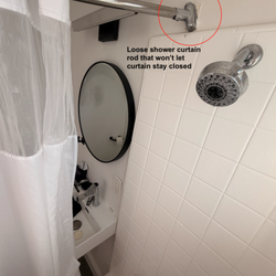Desert Hot Springs Inn - Loose shower curtain rods (leaks on floor)