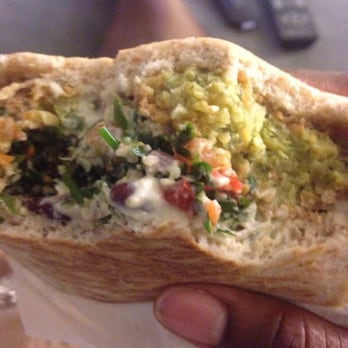 The Green Chicpea - This is a falafel pita with humus, bean salad, and spicy tabouli topped with tahini sauce. - Middle Eastern Near Me - Newark, New Jersey The Green Chicpea - This is a falafel pita with humus, bean salad, and spicy tabouli topped with tahini sauce. - Middle Eastern Near Me - Newark, New Jersey