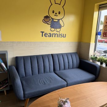 Teamisu Cafe - Couch with wall art - Desserts Near Me - Williston Park, New York Teamisu Cafe - Couch with wall art - Desserts Near Me - Williston Park, New York